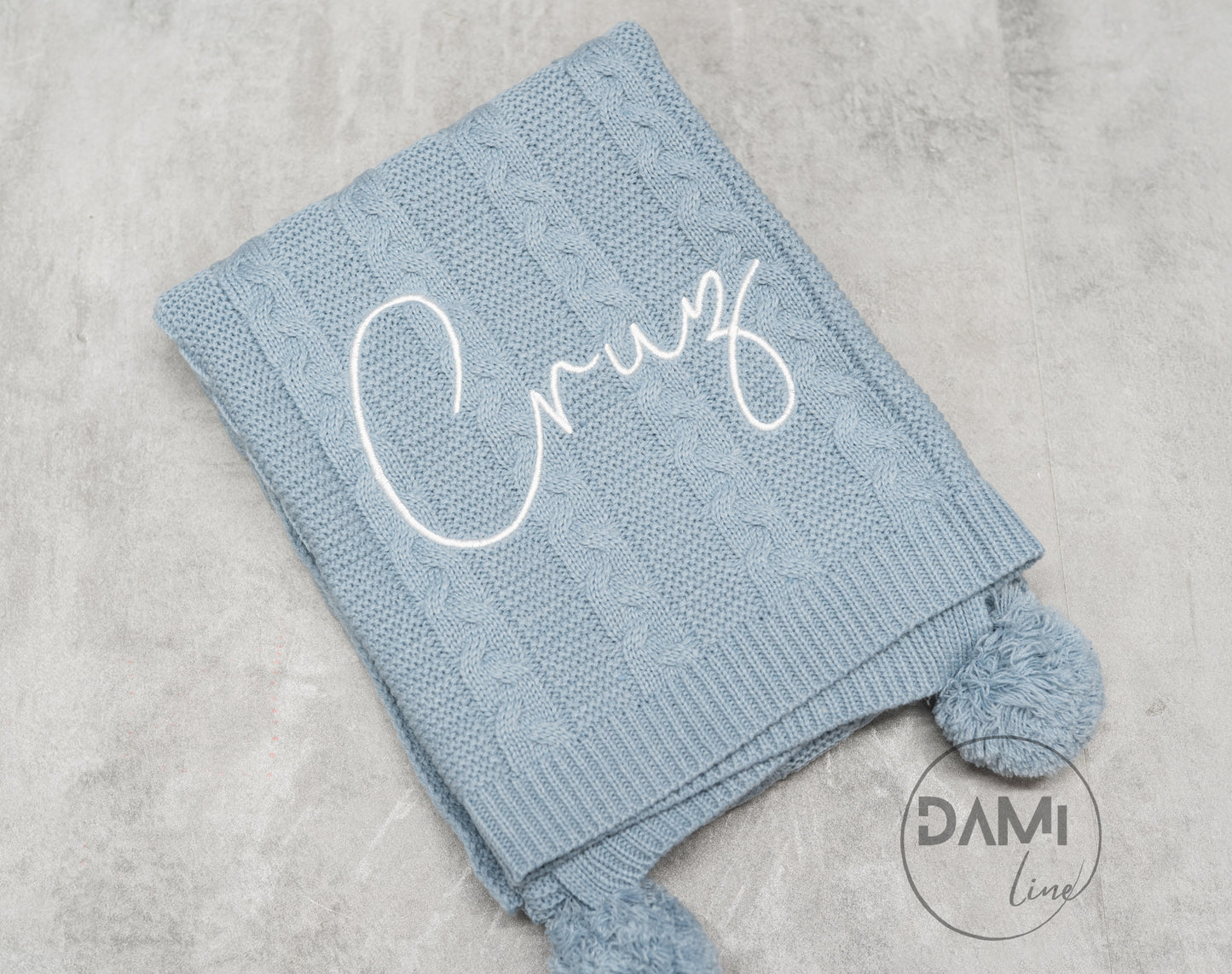 Personalised knitted baby blanket with 2 Pom-poms. Multiple colours available