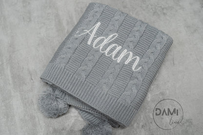Personalised knitted baby blanket with 2 Pom-poms. Multiple colours available