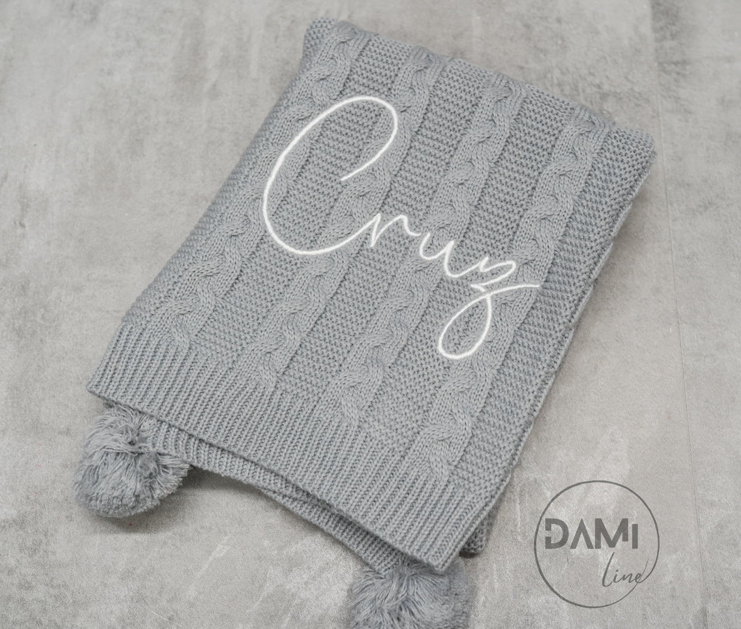 Personalised knitted baby blanket with 2 Pom-poms. Multiple colours available