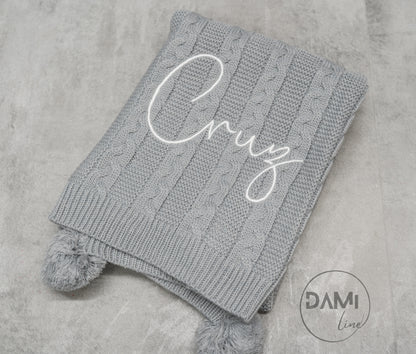 Personalised knitted baby blanket with 2 Pom-poms. Multiple colours available