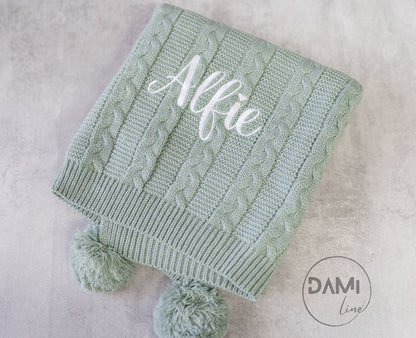 Personalised knitted baby blanket with 2 Pom-poms. Multiple colours available
