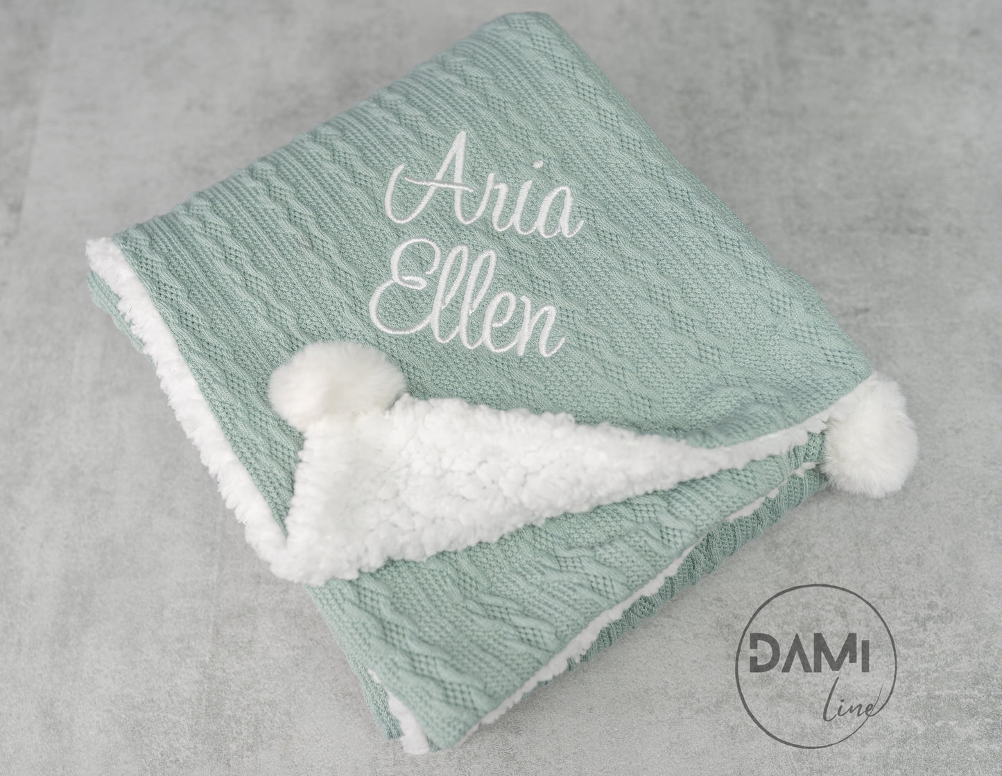 Personalised knitted SAGE baby blanket with sherpa lining and 2 pom-poms.