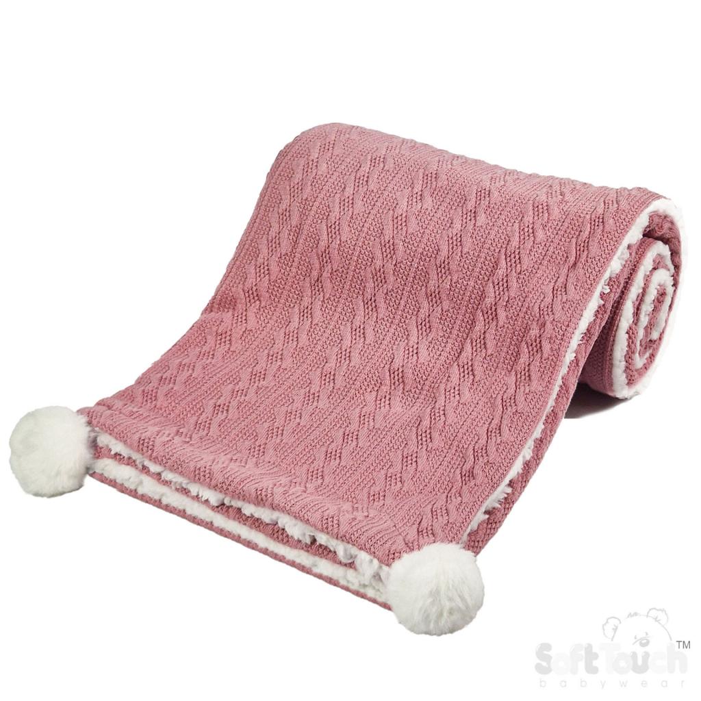 Personalised knitted baby blanket with white sherpa lining and 2 pom-poms.