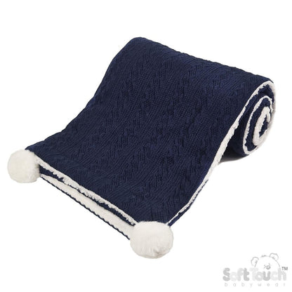 Personalised knitted baby blanket with white sherpa lining and 2 pom-poms.