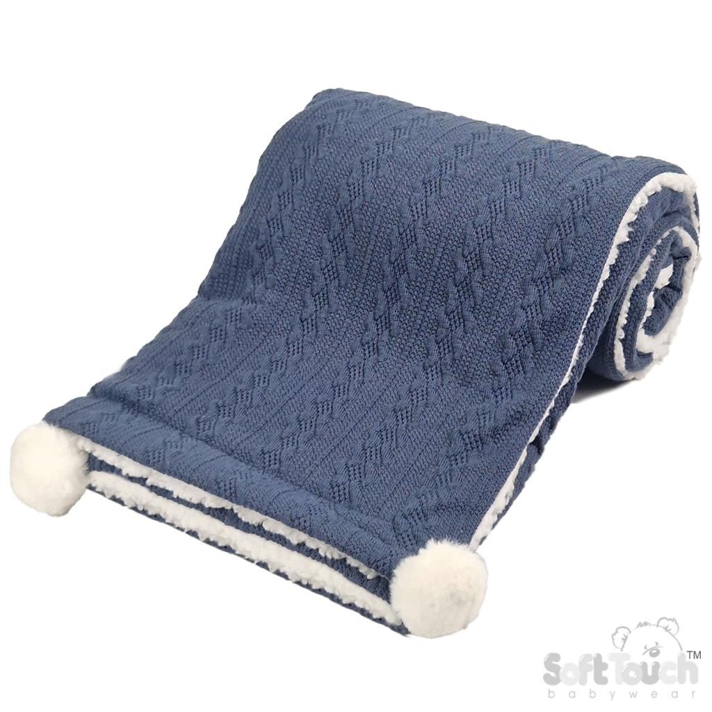Personalised knitted baby blanket with white sherpa lining and 2 pom-poms.