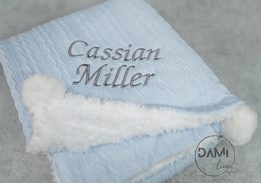 Personalised knitted LIGHT BLUE baby blanket with sherpa lining and 2 pom-poms.