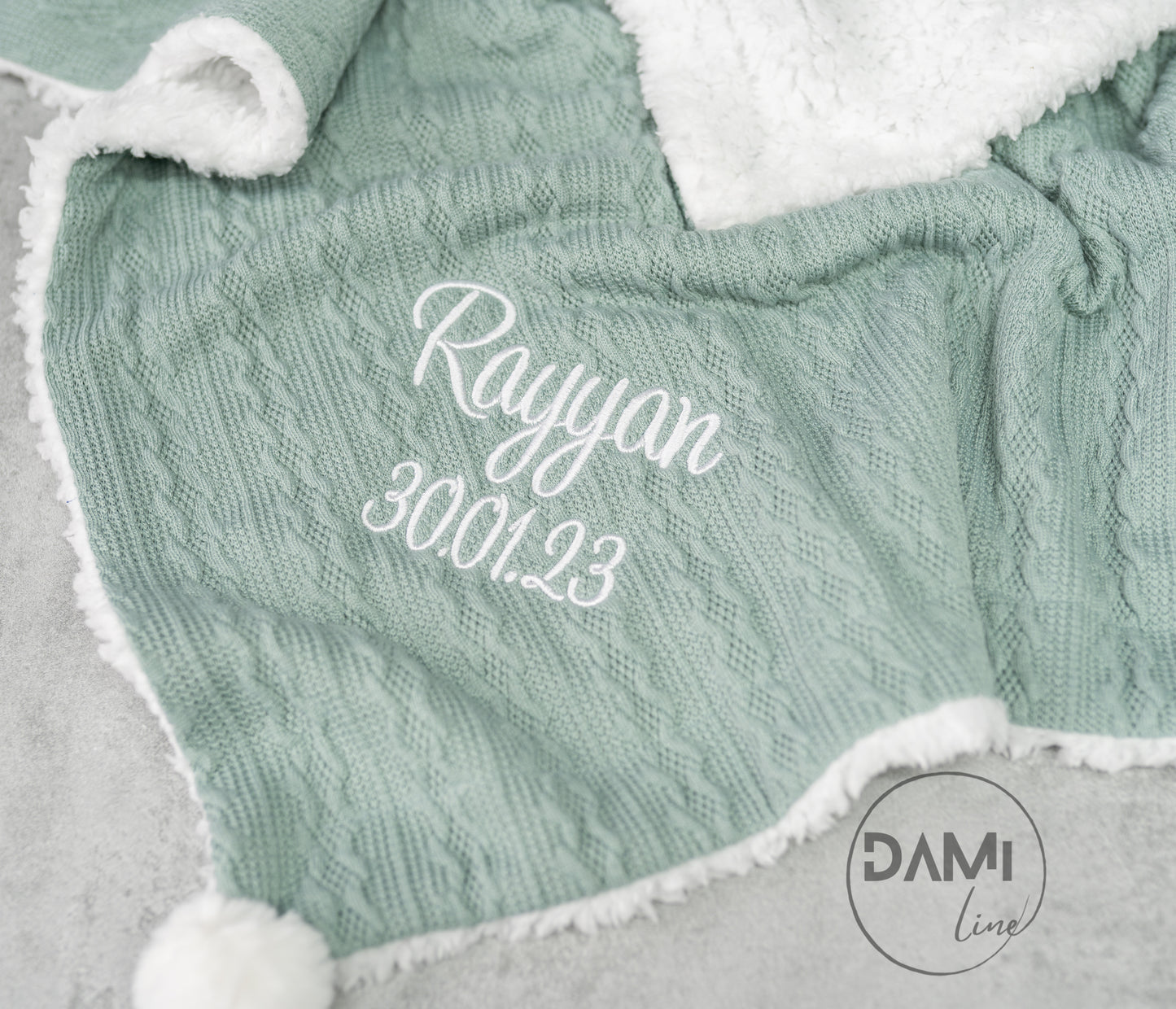 Personalised knitted SAGE baby blanket with sherpa lining and 2 pom-poms.