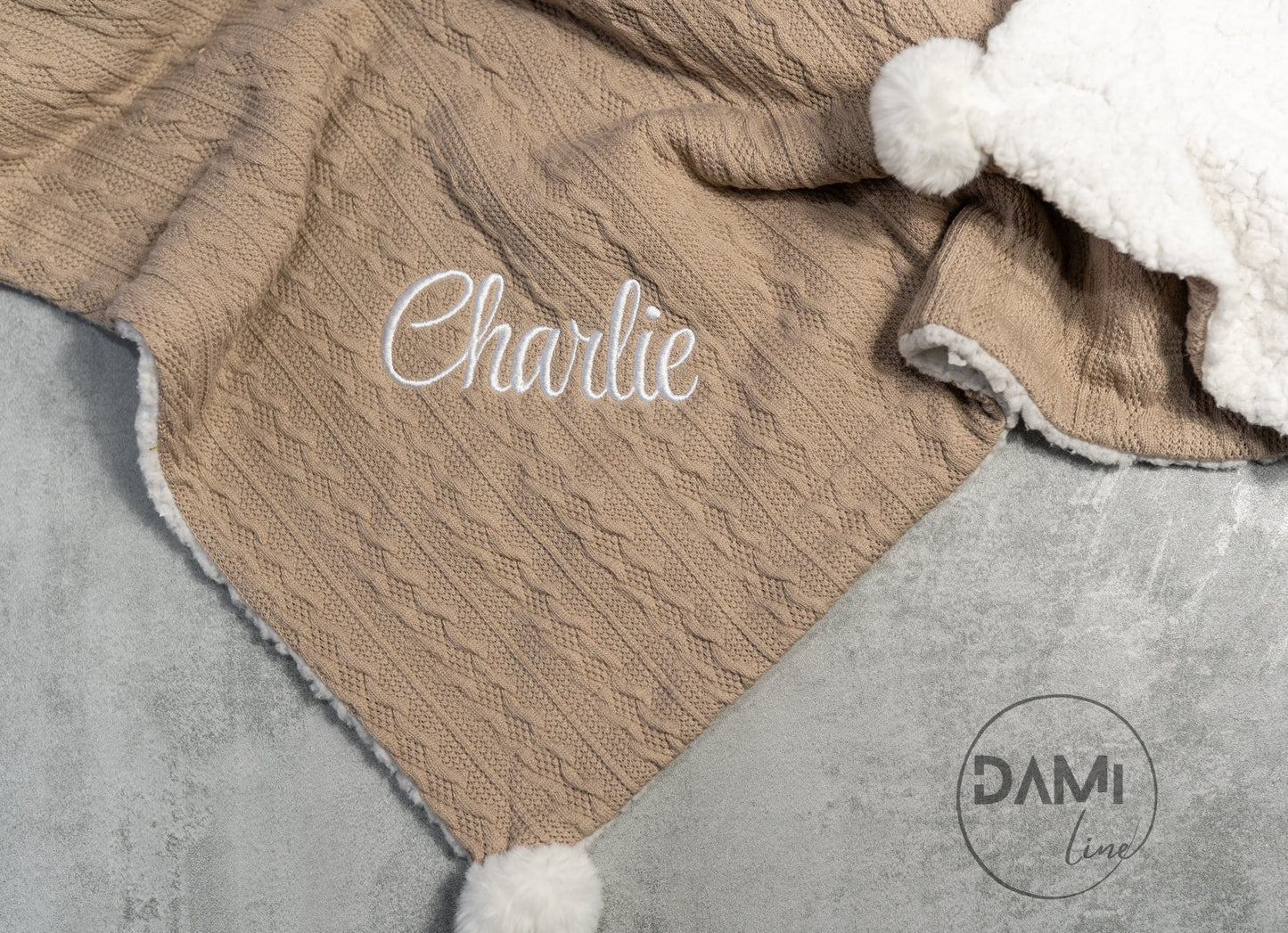 Personalised knitted COFFEE baby blanket with white sherpa lining and 2 pom-poms.